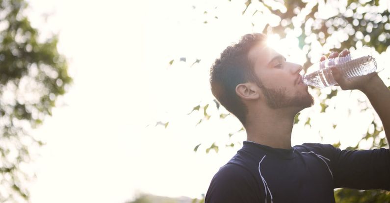 Hydration - Man in Black Crew Neck Shirt Drinking Water