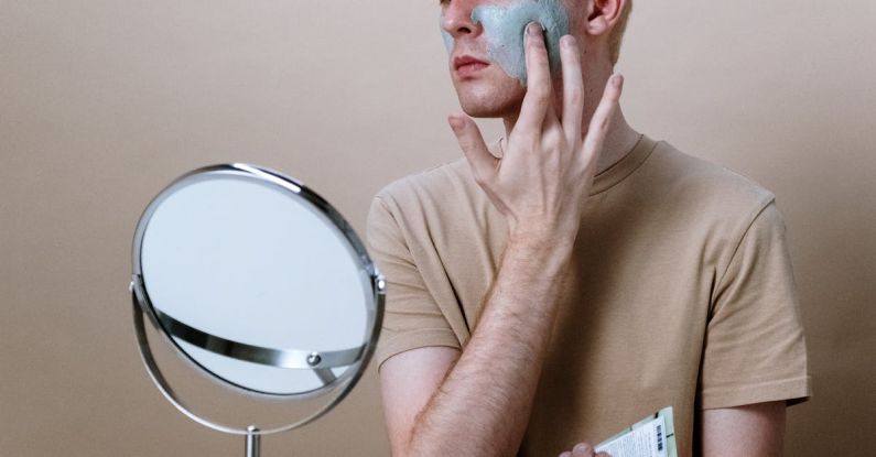 Cleansers - Man in Brown Crew Neck T-shirt Holding Round Mirror