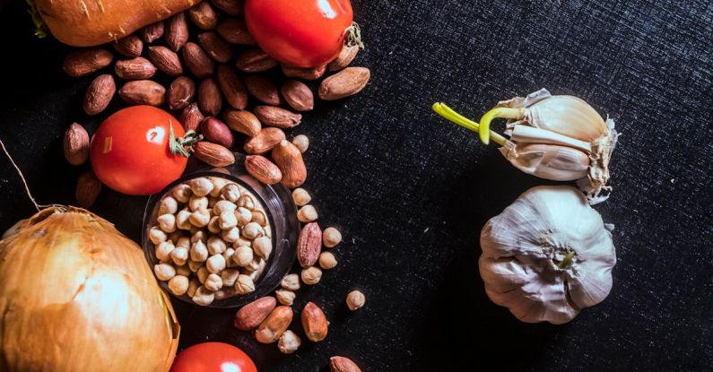 Ingredients - Variety of Spices and Vegetables on Black Surface