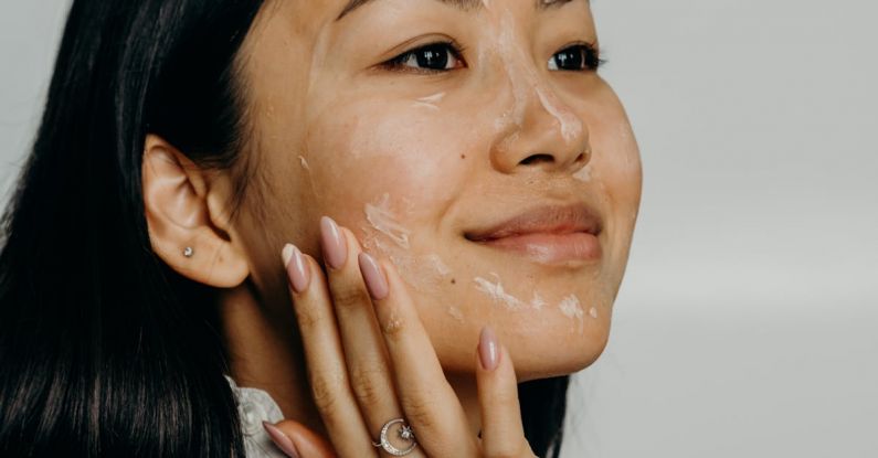 Exfoliants - A Woman Touching Her Face