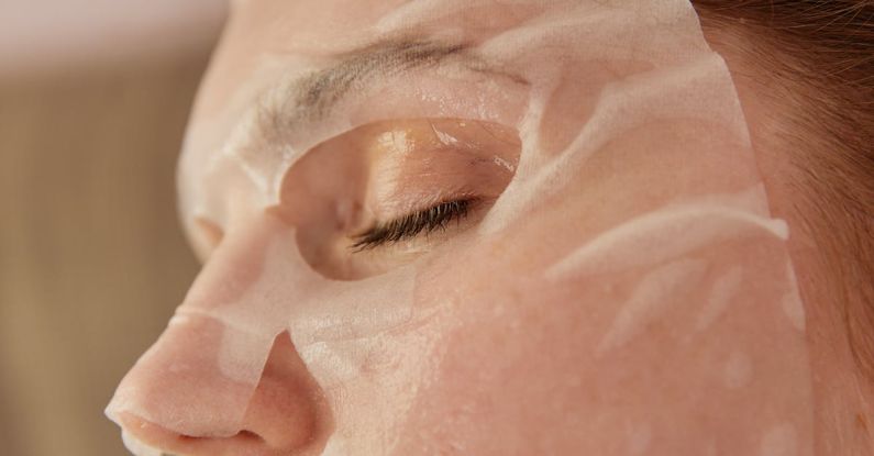 Anti-Aging - A Close-up Shot of a Woman with a Sheet Mask on Face