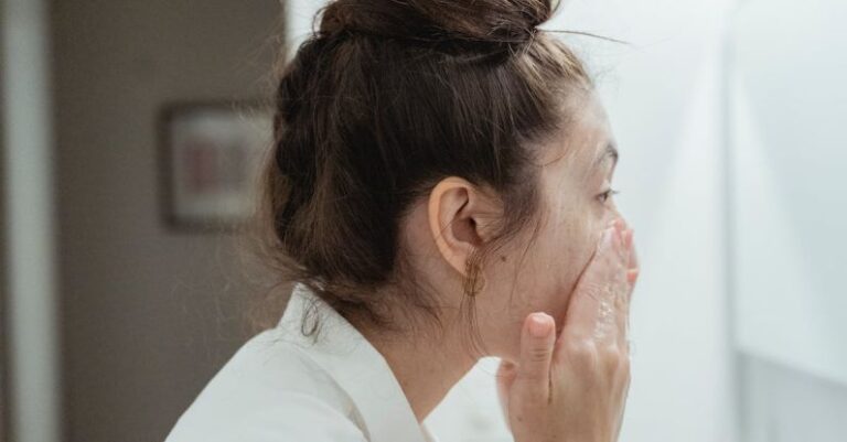 Skincare Routine - Side View of Woman Washing Her Face