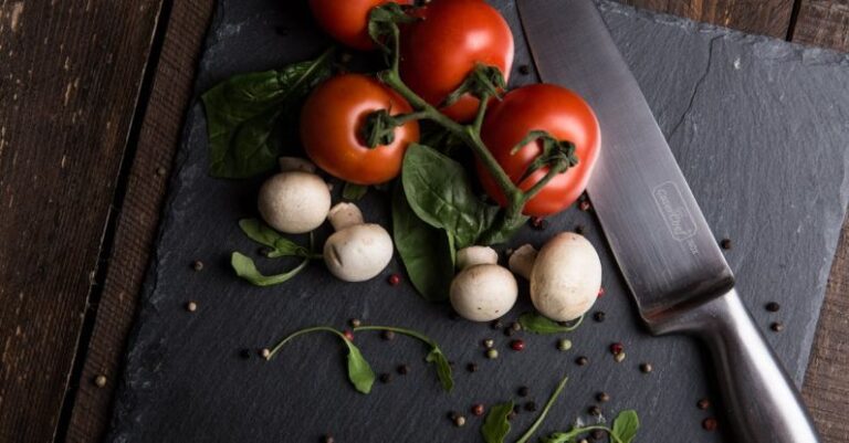 Ingredients - Red Tomatoes, Mushrooms, and Gray Steel Knife